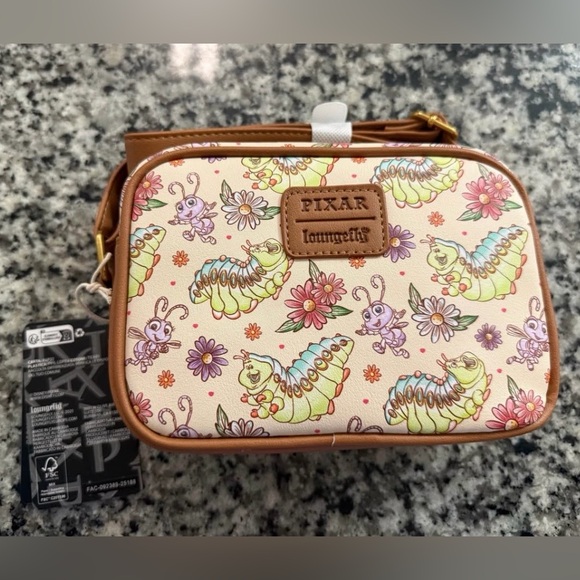 Loungefly Handbags - Loungefly Cream Floral Caterpillar Crossbody Bag with Brown Trim